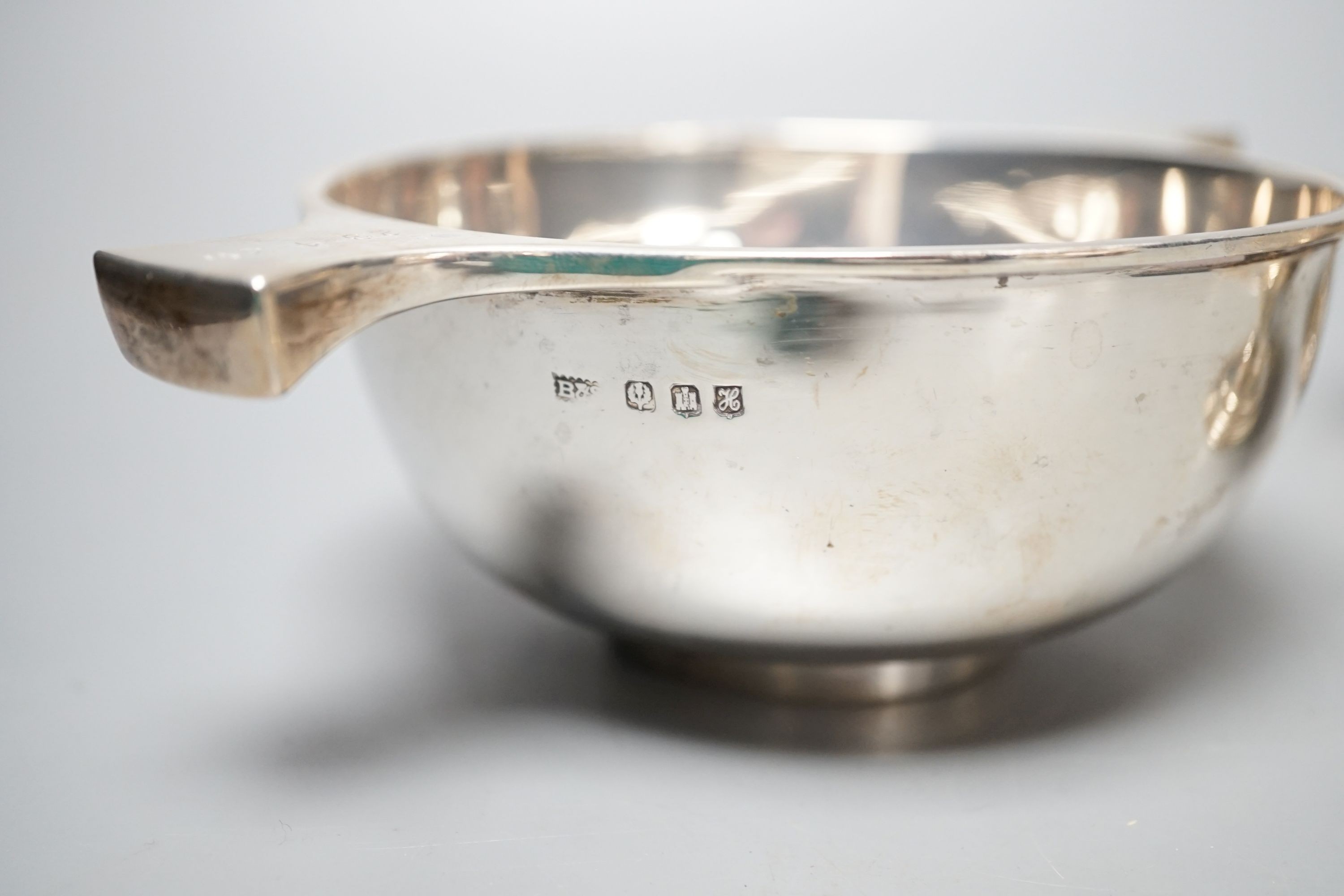 A mixed collection of silver to include a Scottish quaich, a pair of George III boat shaped salts, a George III silver helmet shaped cream jug and a pierced boat-shaped bowl, 17oz.